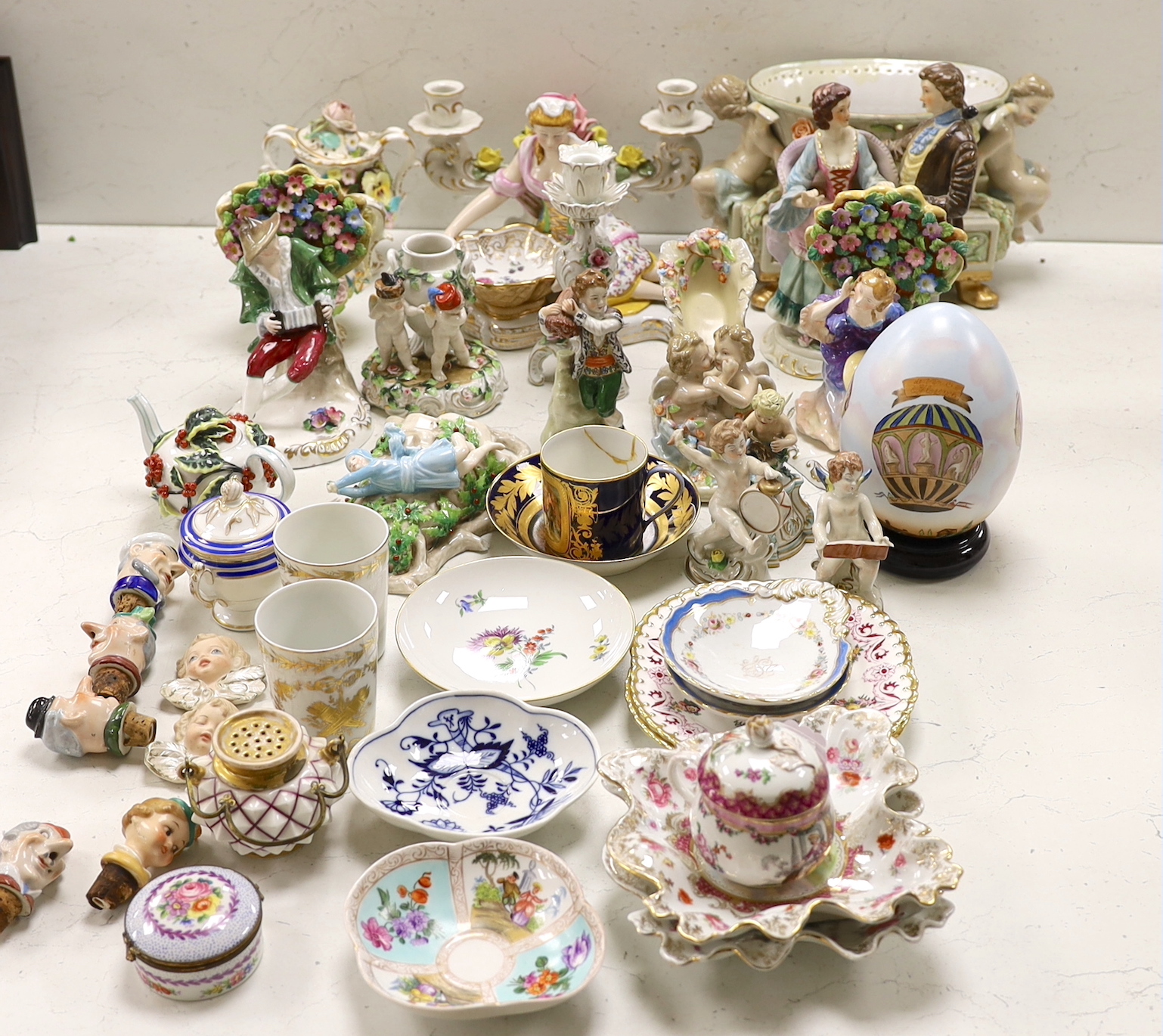 A large group of mainly continental table wares and figurines